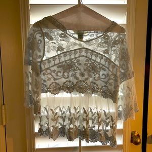 Light blue embroidered Sundance top.